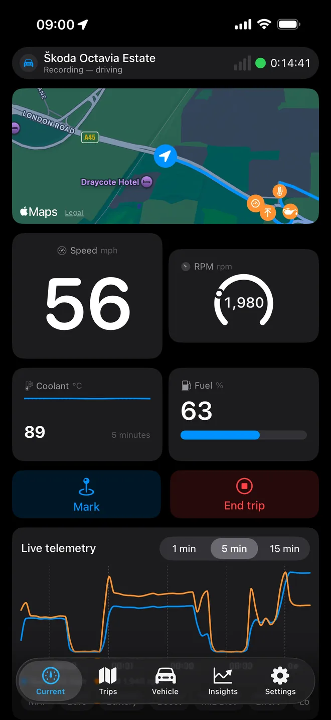 The Current screen during a drive, in dark mode: map, speed, revs, coolant, fuel and a live graph.